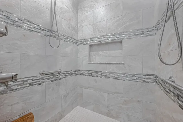 a bathroom with a shower and a bathtub