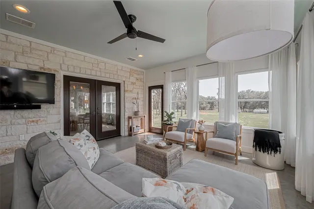 a living room with furniture and a flat screen tv