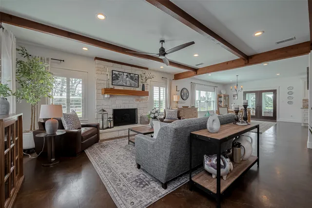 a living room with furniture and a fireplace