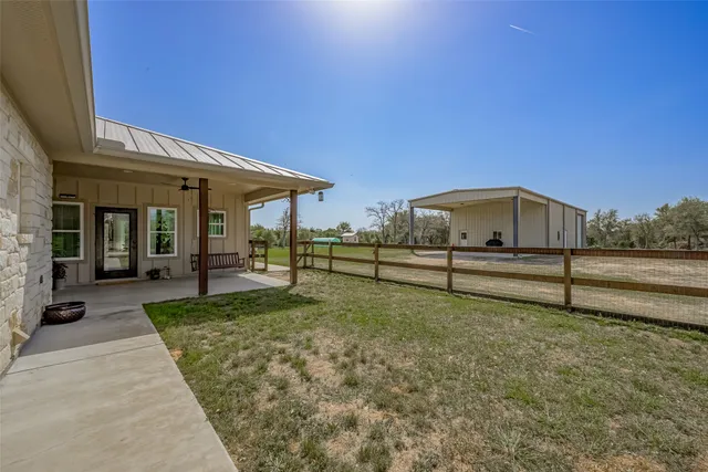 a view of backyard with large trees