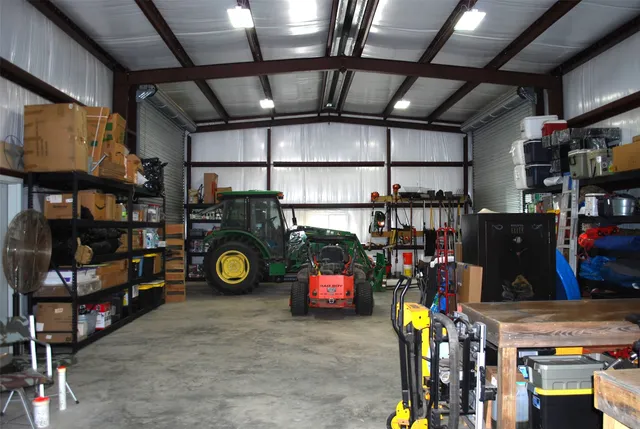 a view of a house with backyard and a tree