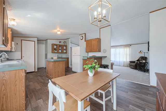 a view of a chairs and table in the balcony
