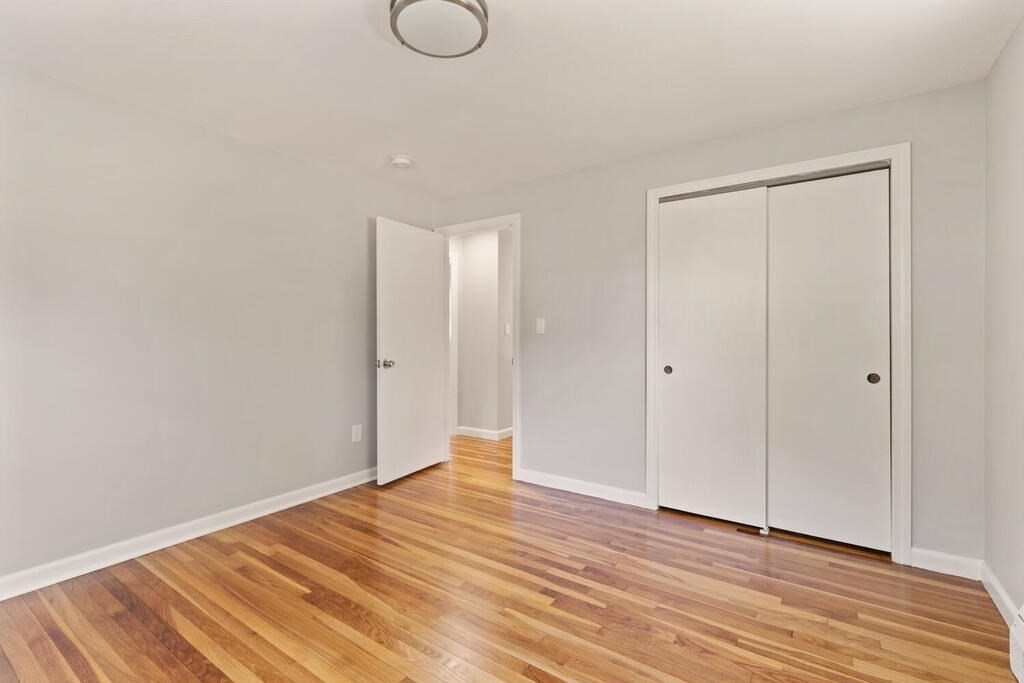 8 Smith Road Randolph, MA 02368 - Photo 11 of 31 a view of a livingroom with wooden floor