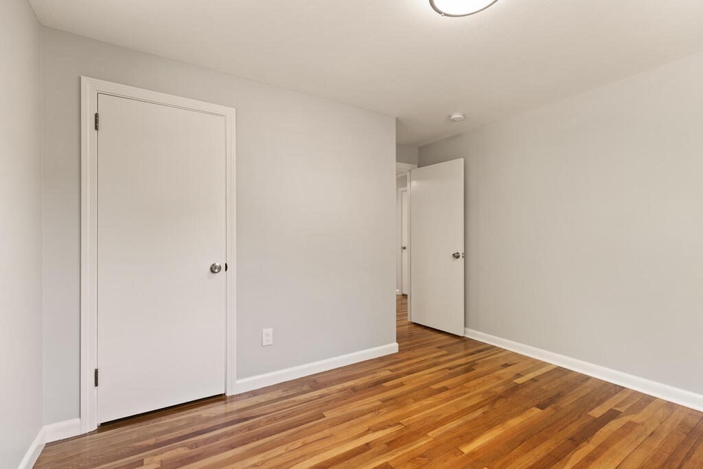 8 Smith Road Randolph, MA 02368 - Photo 13 of 31 a view of an empty room with wooden floor