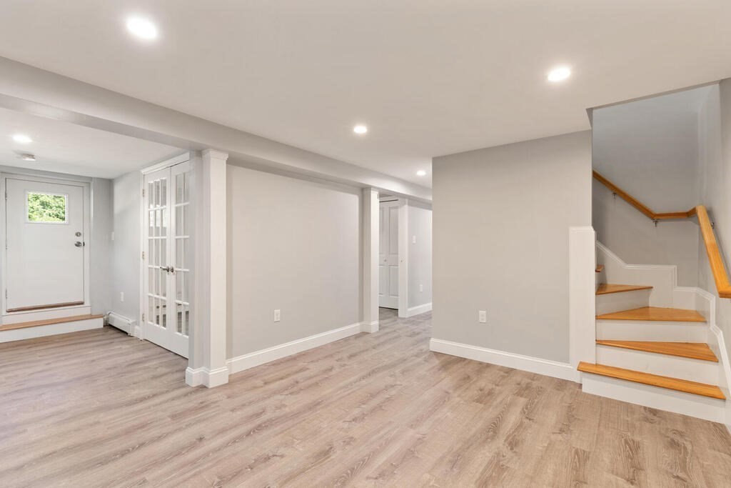 8 Smith Road Randolph, MA 02368 - Photo 18 of 31 wooden floor in an empty room with a window