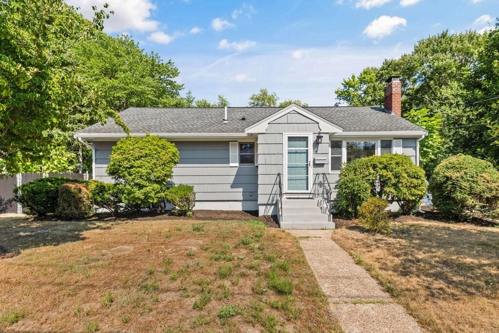 8 Smith Road Randolph, MA 02368 - Photo 2 of 31 a front view of a house with garden
