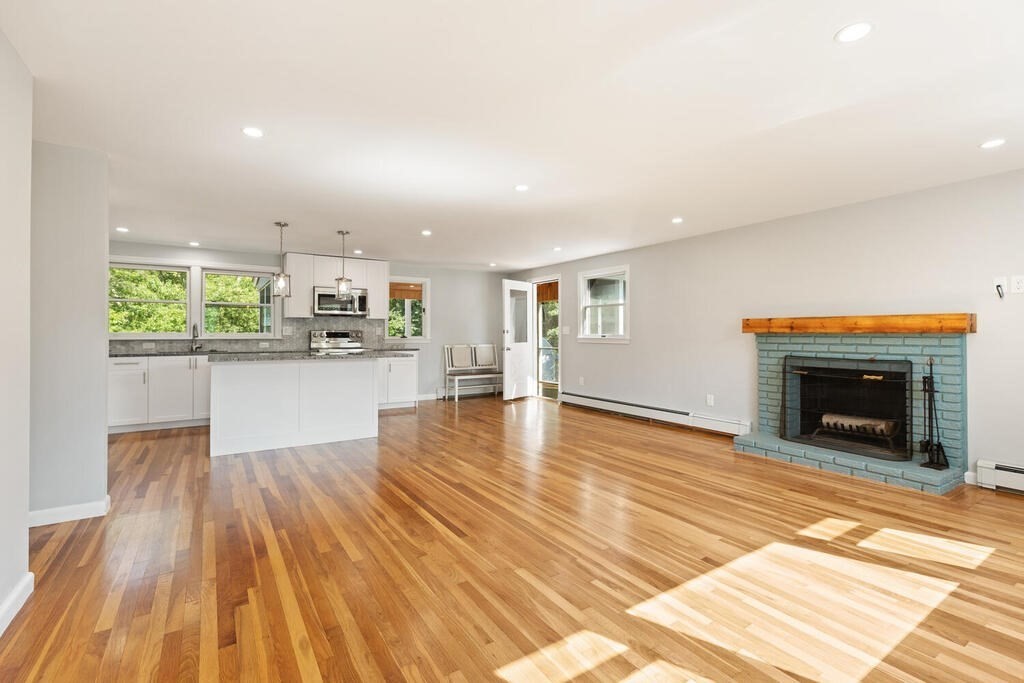 8 Smith Road Randolph, MA 02368 - Photo 8 of 31 a view of a kitchen with a sink and a fireplace