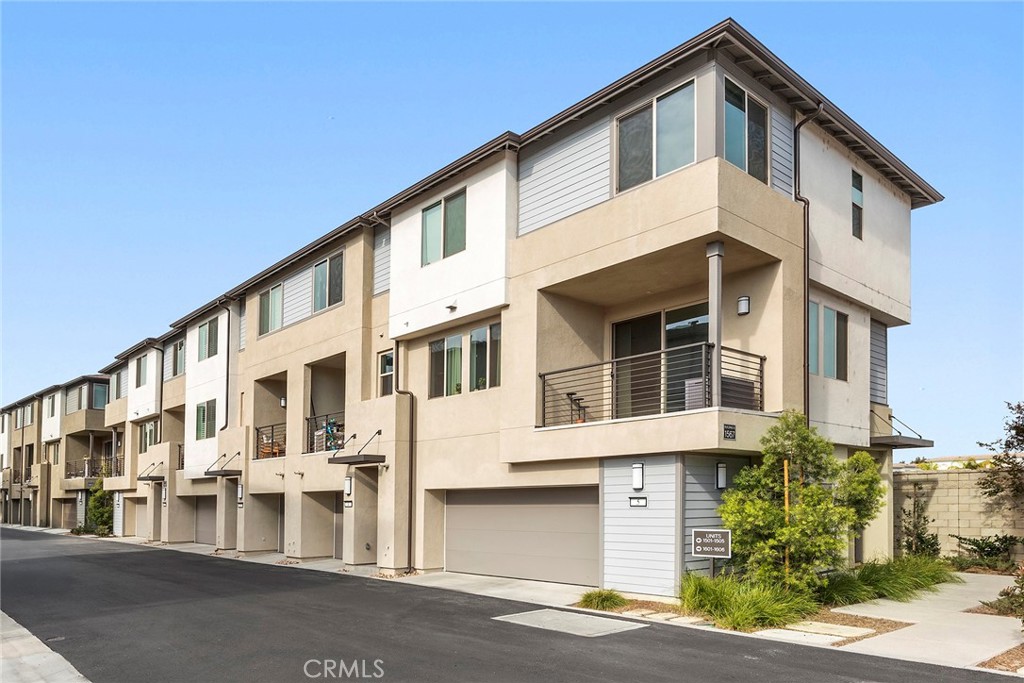1567 Lima Way, Unit 1 Placentia, CA 92870 - Photo 1 of 21 a front view of a building with a street