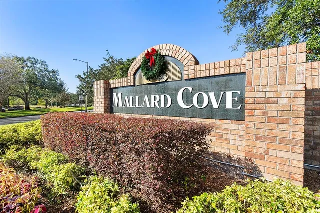 a view of outdoor space with sign board and garden