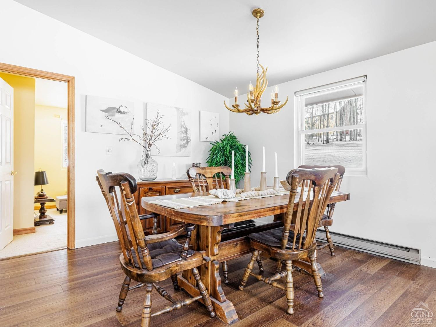 89 Siam Road Windham, NY 12496 - Photo 12 of 31 a view of a dining room with furniture window and wooden floor