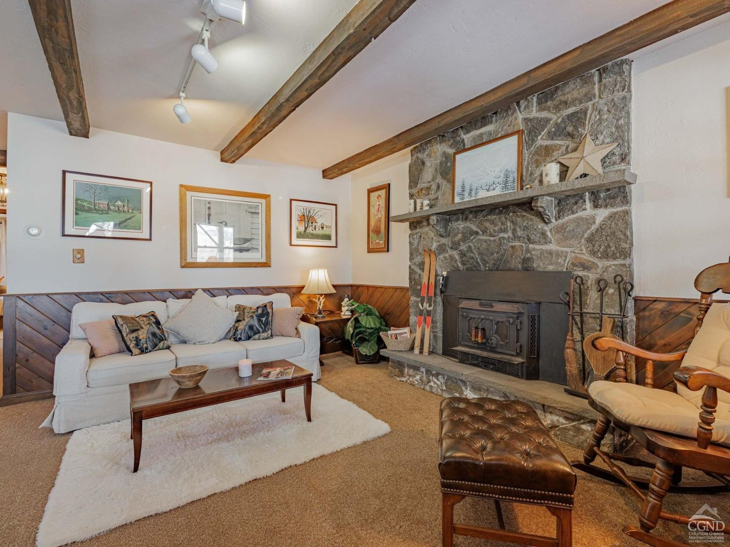 89 Siam Road Windham, NY 12496 - Photo 14 of 31 a living room with furniture and a fireplace