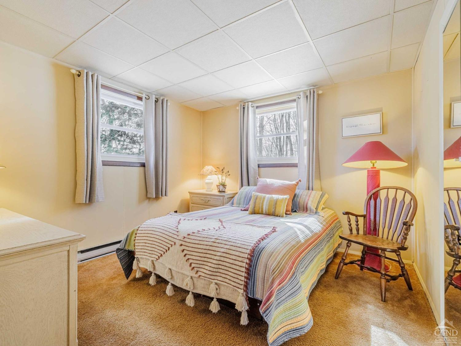 89 Siam Road Windham, NY 12496 - Photo 25 of 31 a bedroom with a bed and a chandelier