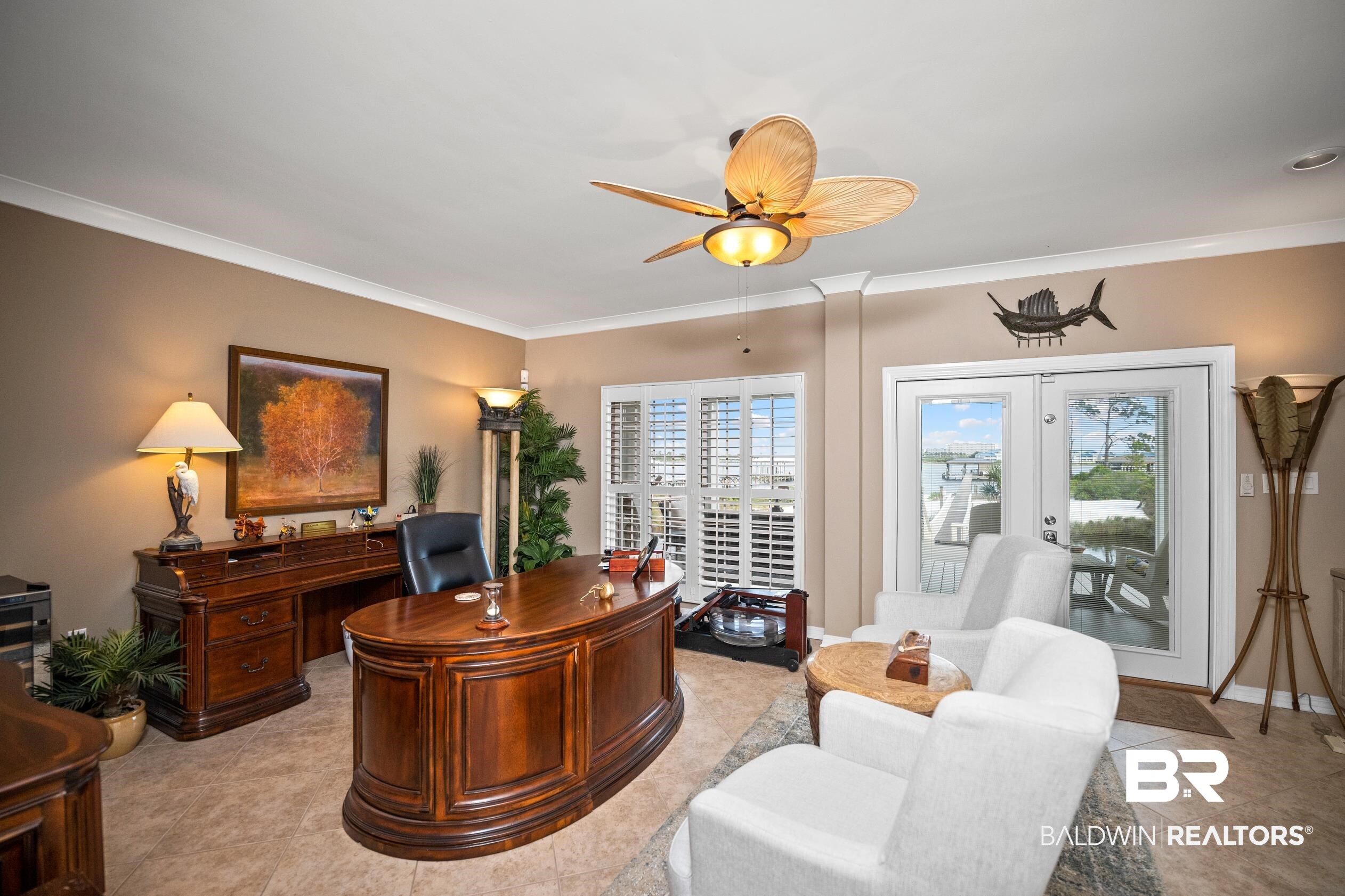 30954 River Road Orange Beach, AL 36561 - Photo 43 of 59 Office space with plenty of natural light, crown molding, a ceiling fan, french doors, and light tile patterned floors