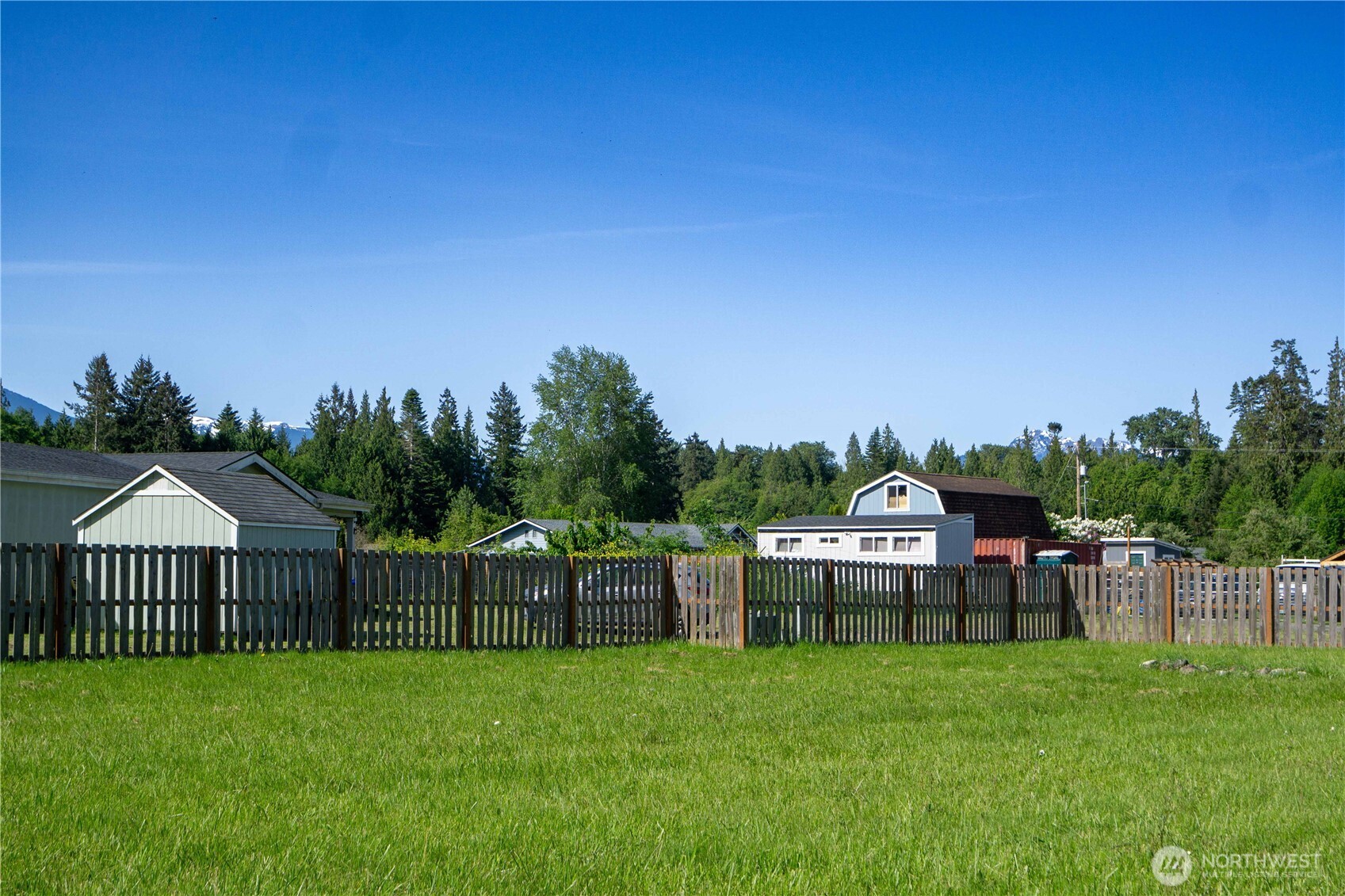 2 Community Lane Sequim, WA 98382 - Photo 1 of 33 a view of a house with backyard and sitting area