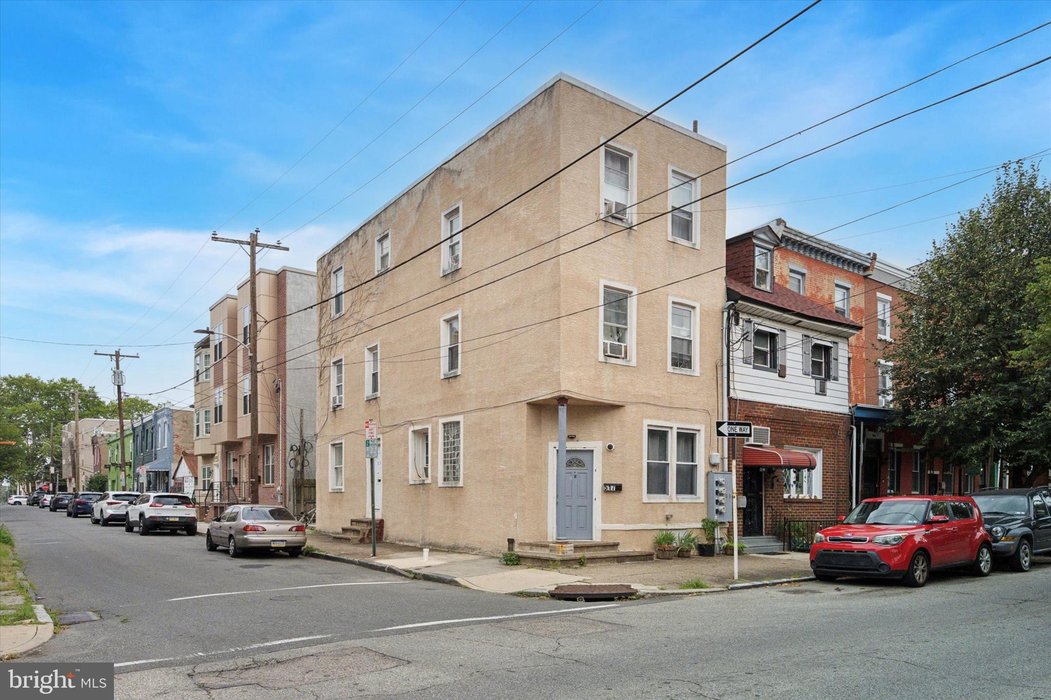 517 North 35th Street Philadelphia, PA 19104 - Photo 1 of 24 a city street lined with parked cars and buildings