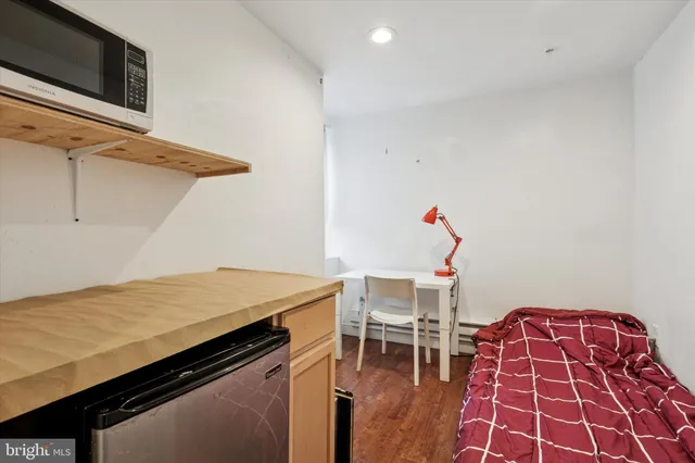 a workspace with furniture and wooden floor