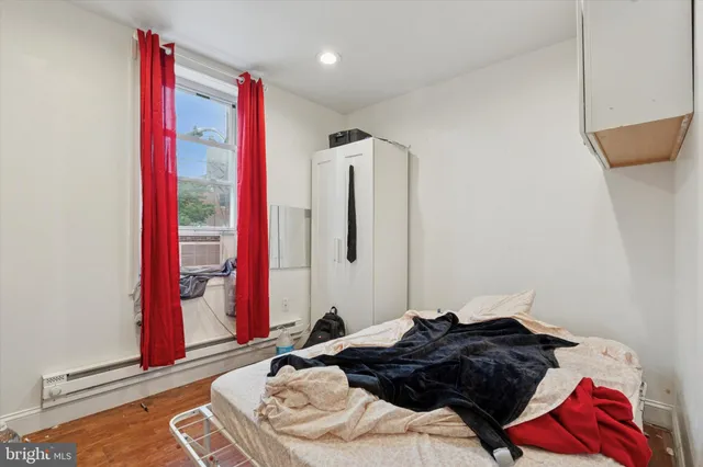 a bedroom with a bed and a closet