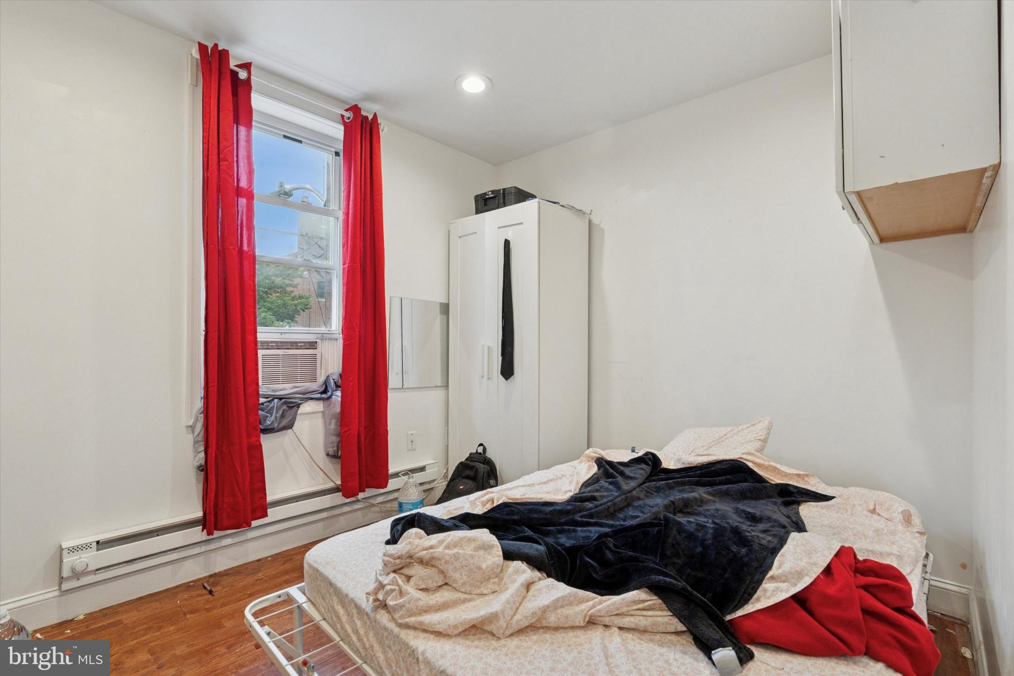 517 North 35th Street Philadelphia, PA 19104 - Photo 18 of 24 a bedroom with a bed and a closet