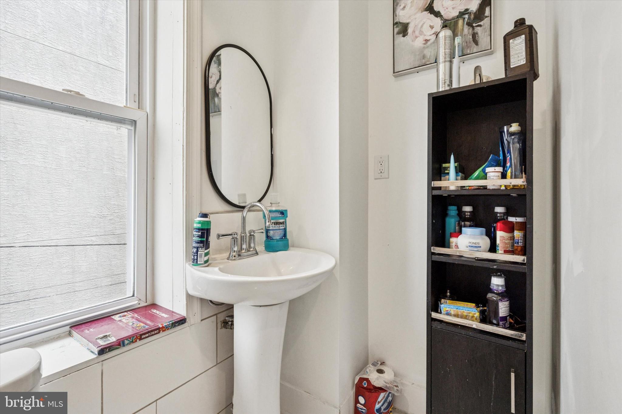 517 North 35th Street Philadelphia, PA 19104 - Photo 21 of 24 a bathroom with a sink and a mirror