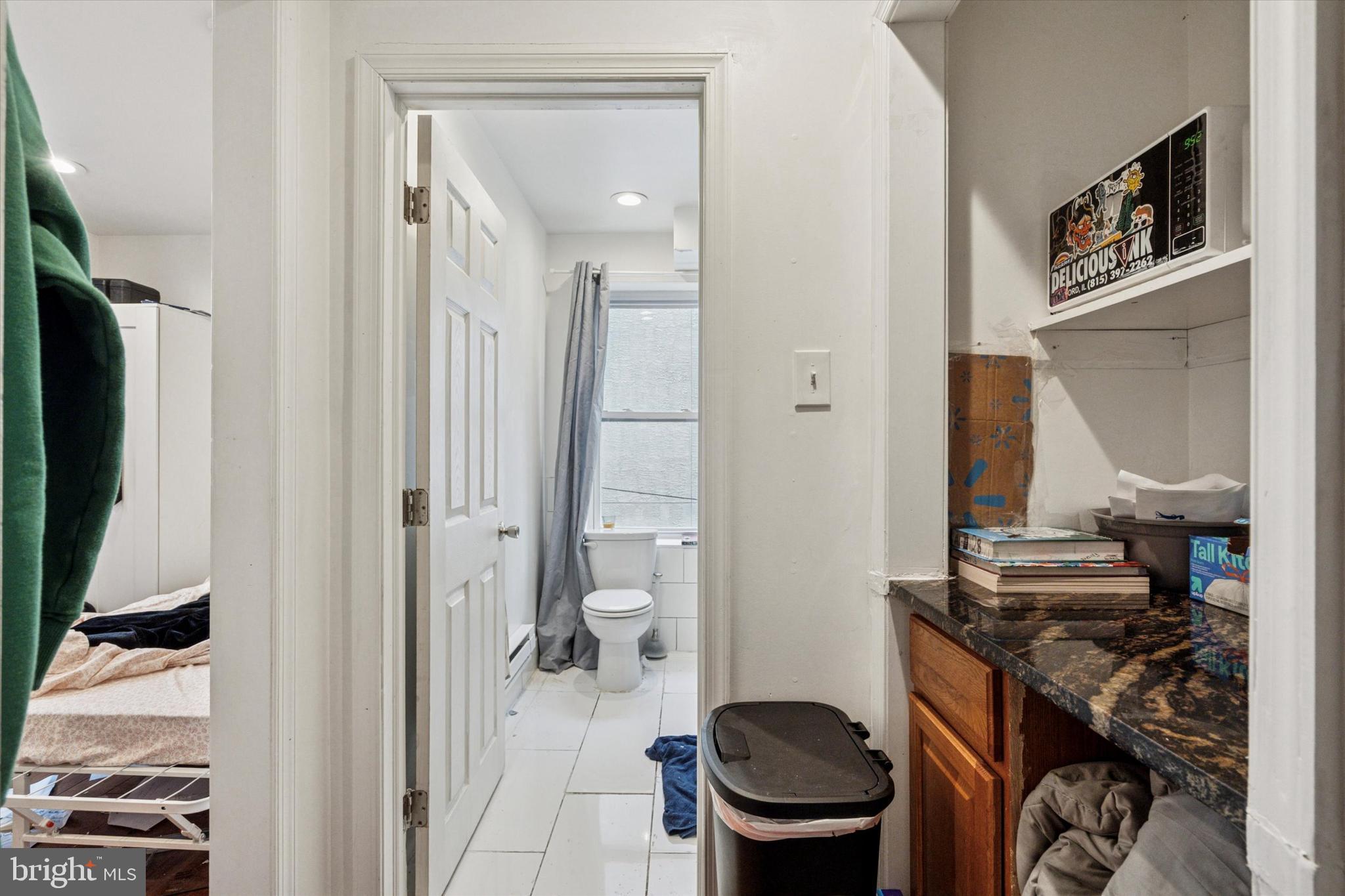 517 North 35th Street Philadelphia, PA 19104 - Photo 23 of 24 a bathroom with a toilet and a mirror
