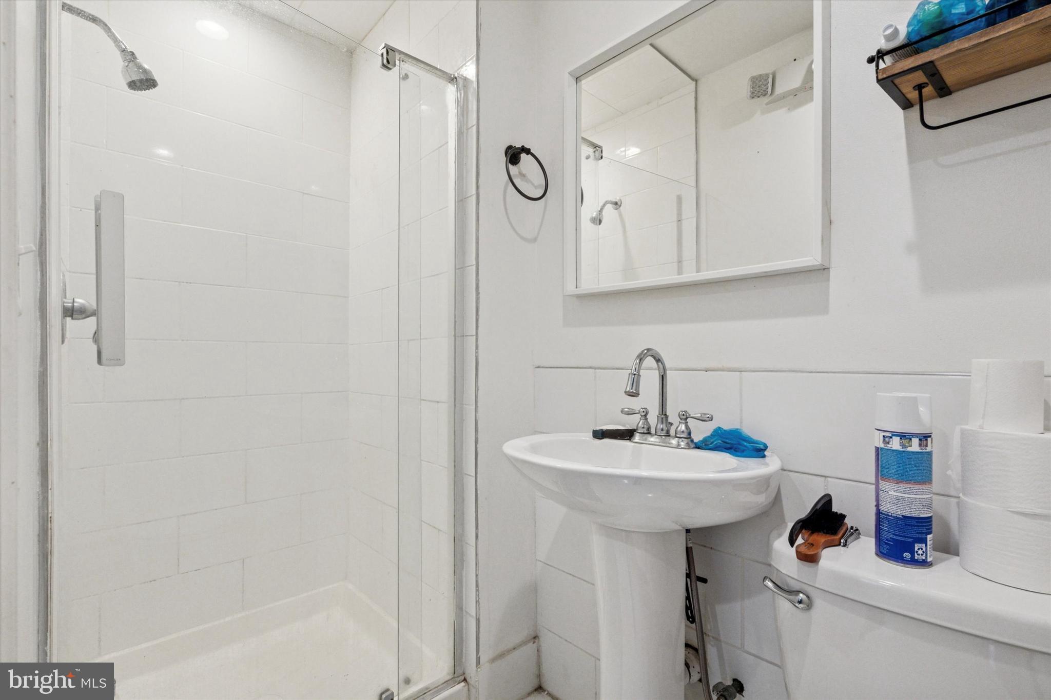517 North 35th Street Philadelphia, PA 19104 - Photo 8 of 24 a bathroom with a sink toilet and shower