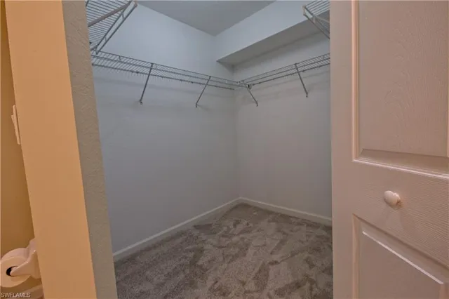 a view of a room with racks on the wall