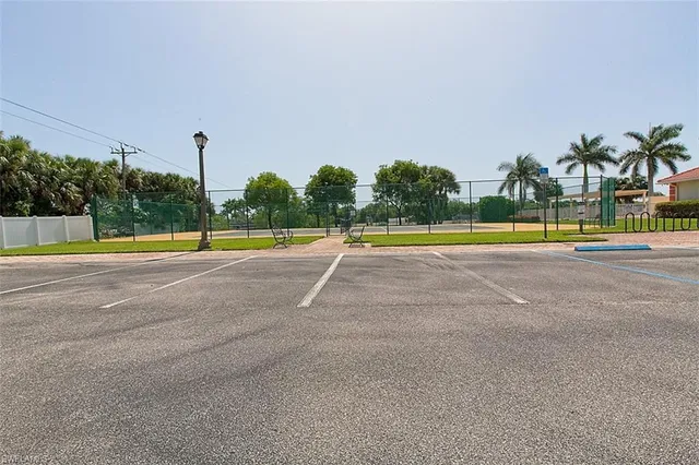 a view of a swimming pool with an outdoor space and seating area