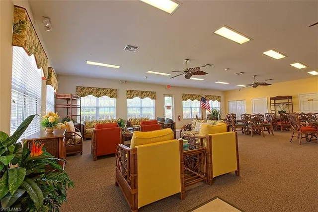 a view of a dining room with furniture water view and natural light