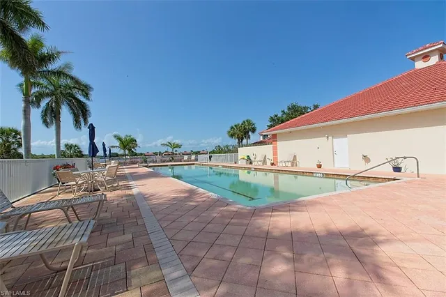 a view of a swimming pool with a lounge chairs