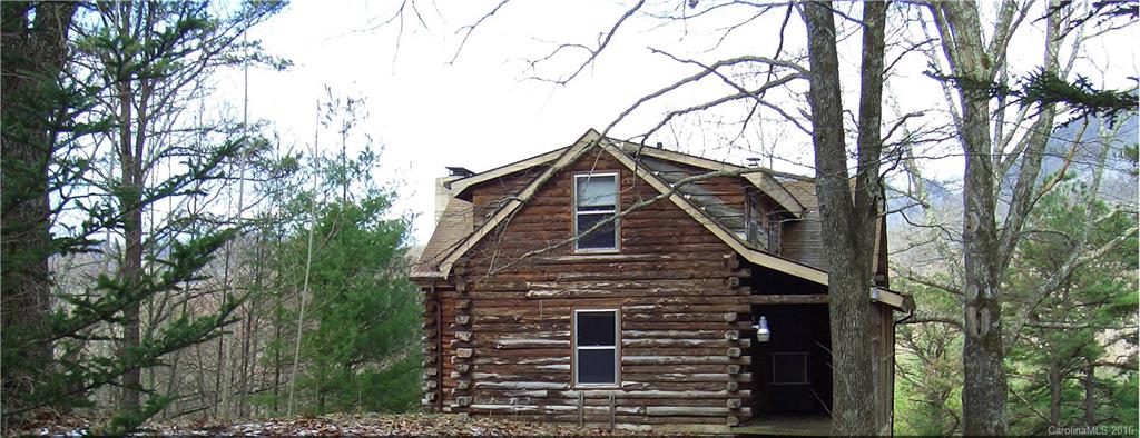 833 Hidden Valley Road Clyde, NC 28721 - Photo 11 of 14 a front view of a house with trees