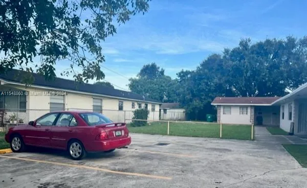 a front view of a house with truck parked