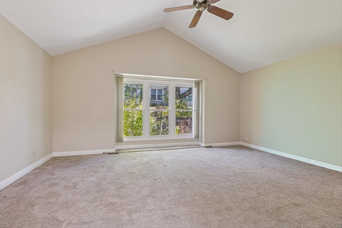 417 River Bluff Circle Naperville, IL 60540 - Photo 11 of 20 a view of an empty room with a window