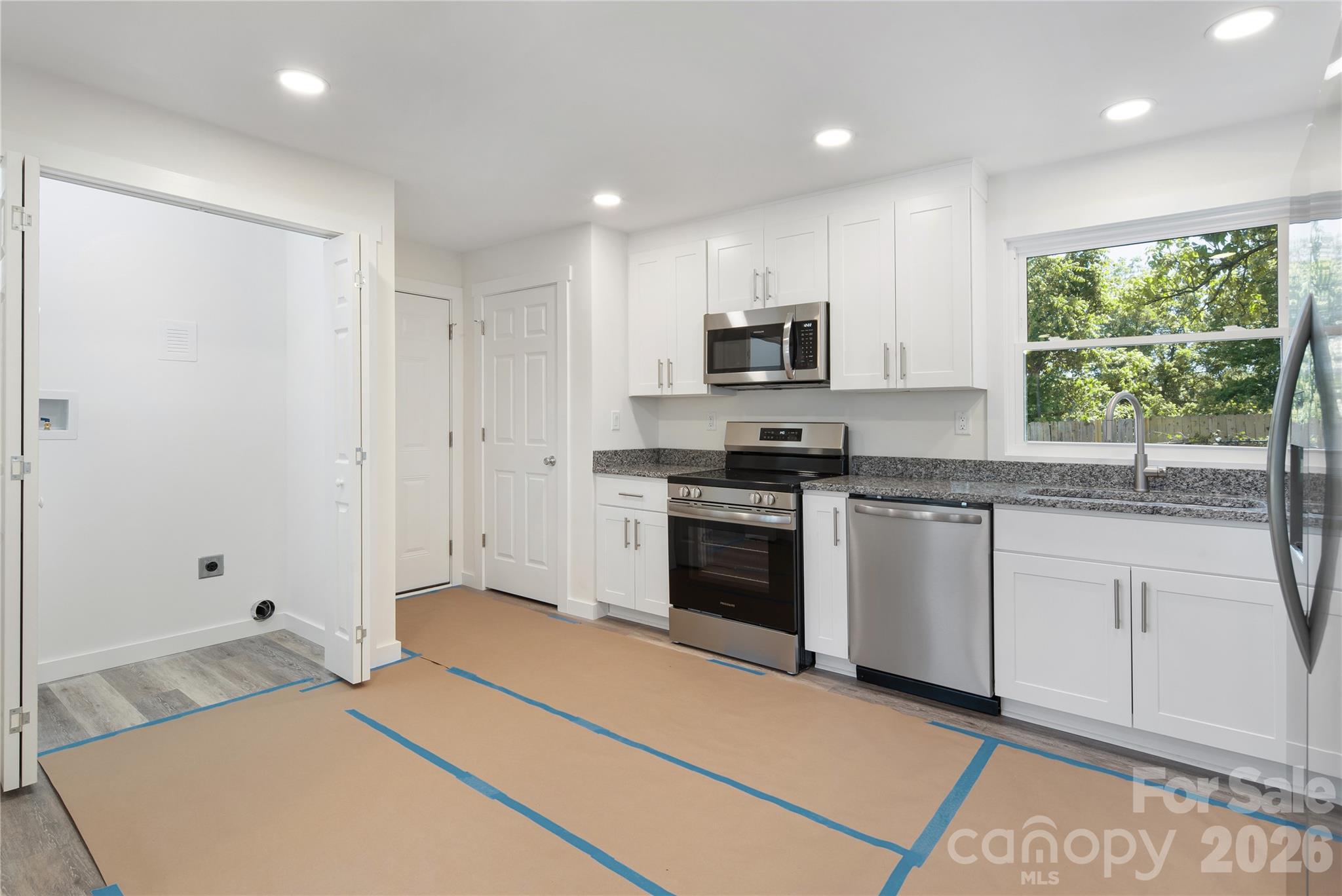 287 Duncan Road Flat Rock, NC 28731 - Photo 7 of 13 a kitchen with stainless steel appliances a stove sink and microwave