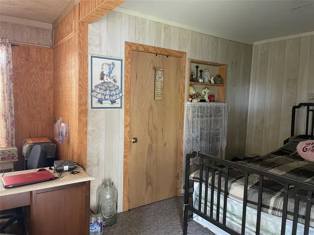 a room with a door open to a room