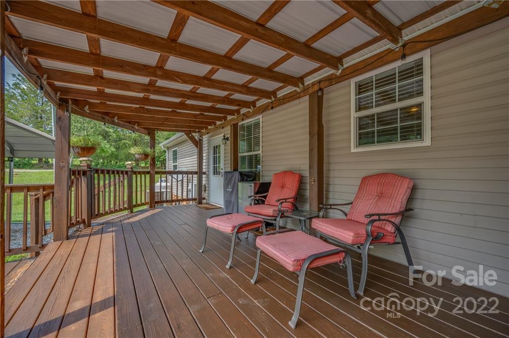 2393 Pearidge Road Bostic, NC 28018 - Photo 9 of 39 a view of a chairs in wooden deck