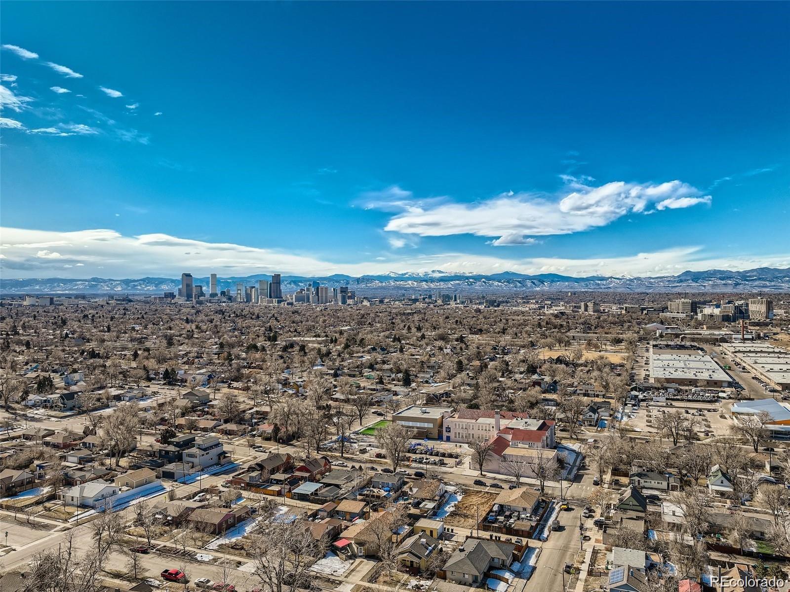 3815 Madison Street Denver, CO 80205 - Photo 7 of 7 an aerial view of a city