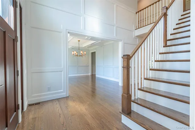 a view of entryway with wooden floor