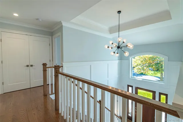 a view of a balcony with chandelier