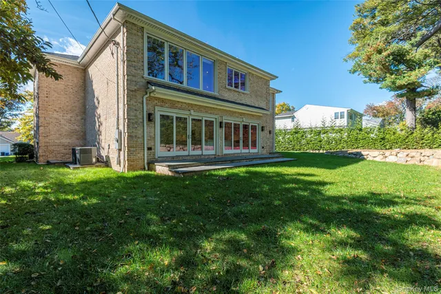 a front view of a house with a yard table and chairs