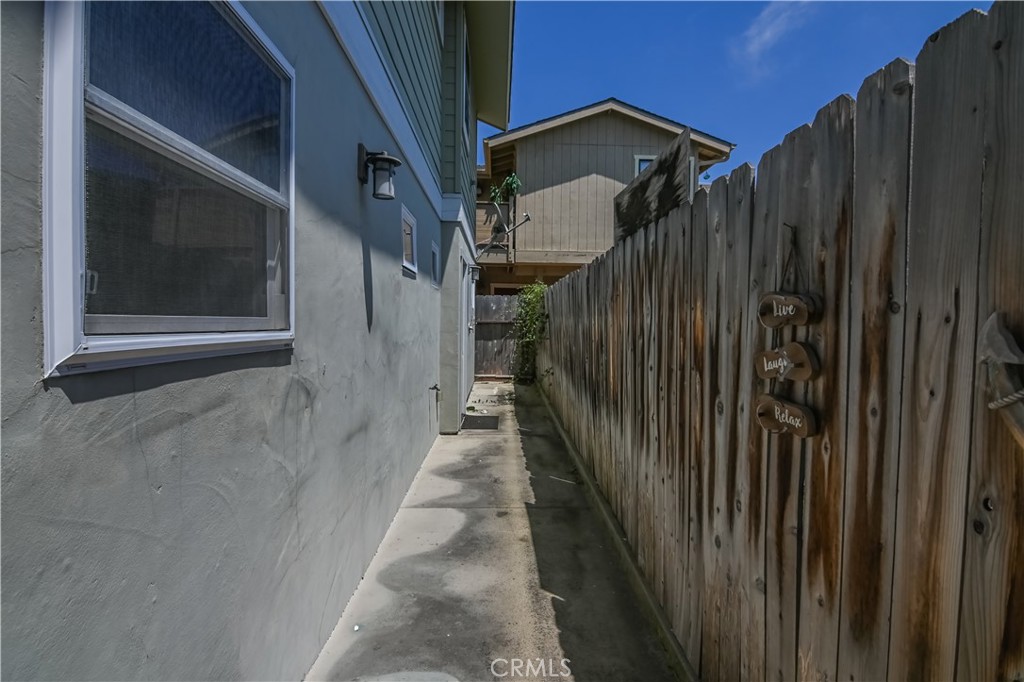 350 Java Street Morro Bay, CA 93442 - Photo 13 of 26 a view of a house with a wooden door and wooden wall