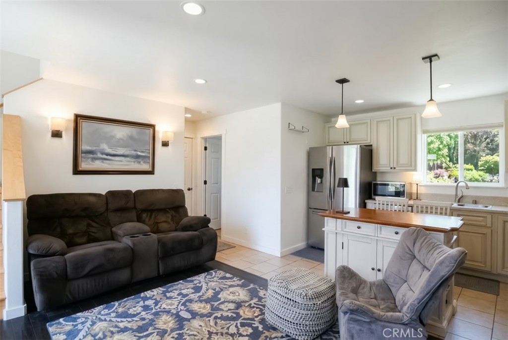 350 Java Street Morro Bay, CA 93442 - Photo 17 of 26 a living room with furniture and a chandelier