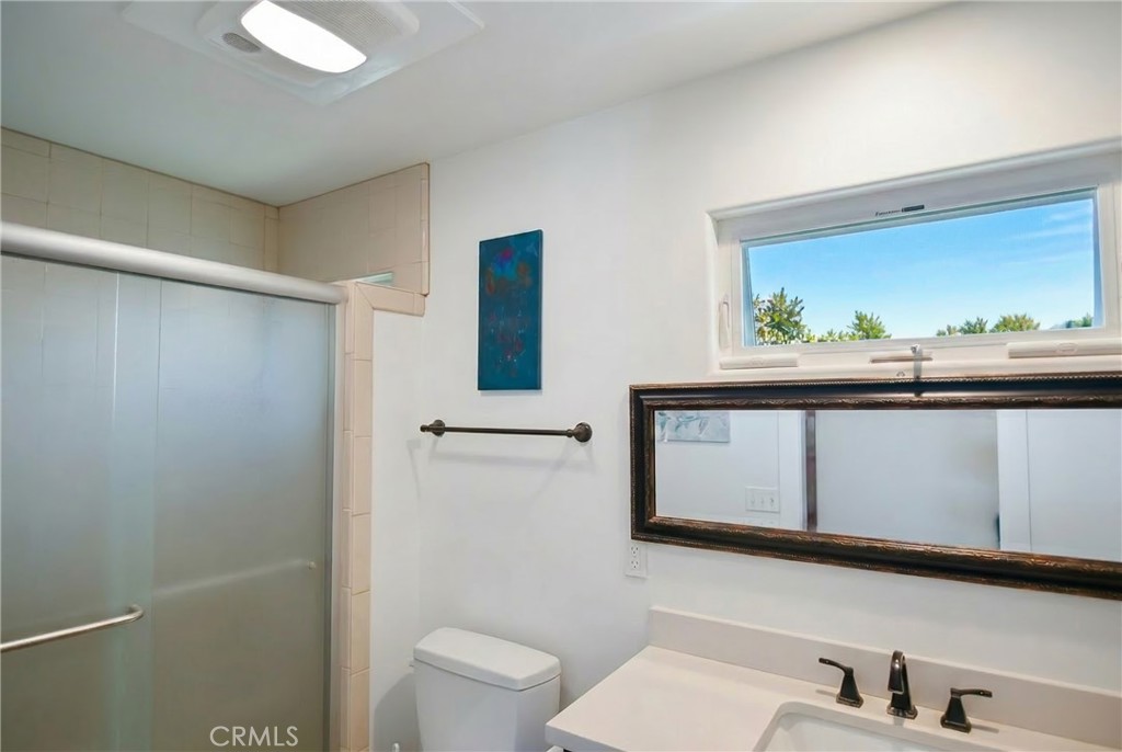 350 Java Street Morro Bay, CA 93442 - Photo 19 of 26 a bathroom with a sink a toilet and mirror