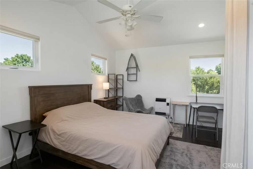 350 Java Street Morro Bay, CA 93442 - Photo 21 of 26 a bedroom with a bed and a table in it