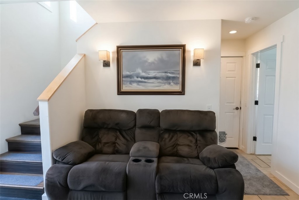 350 Java Street Morro Bay, CA 93442 - Photo 23 of 26 a blue couch sitting next to a blue wall and a painting