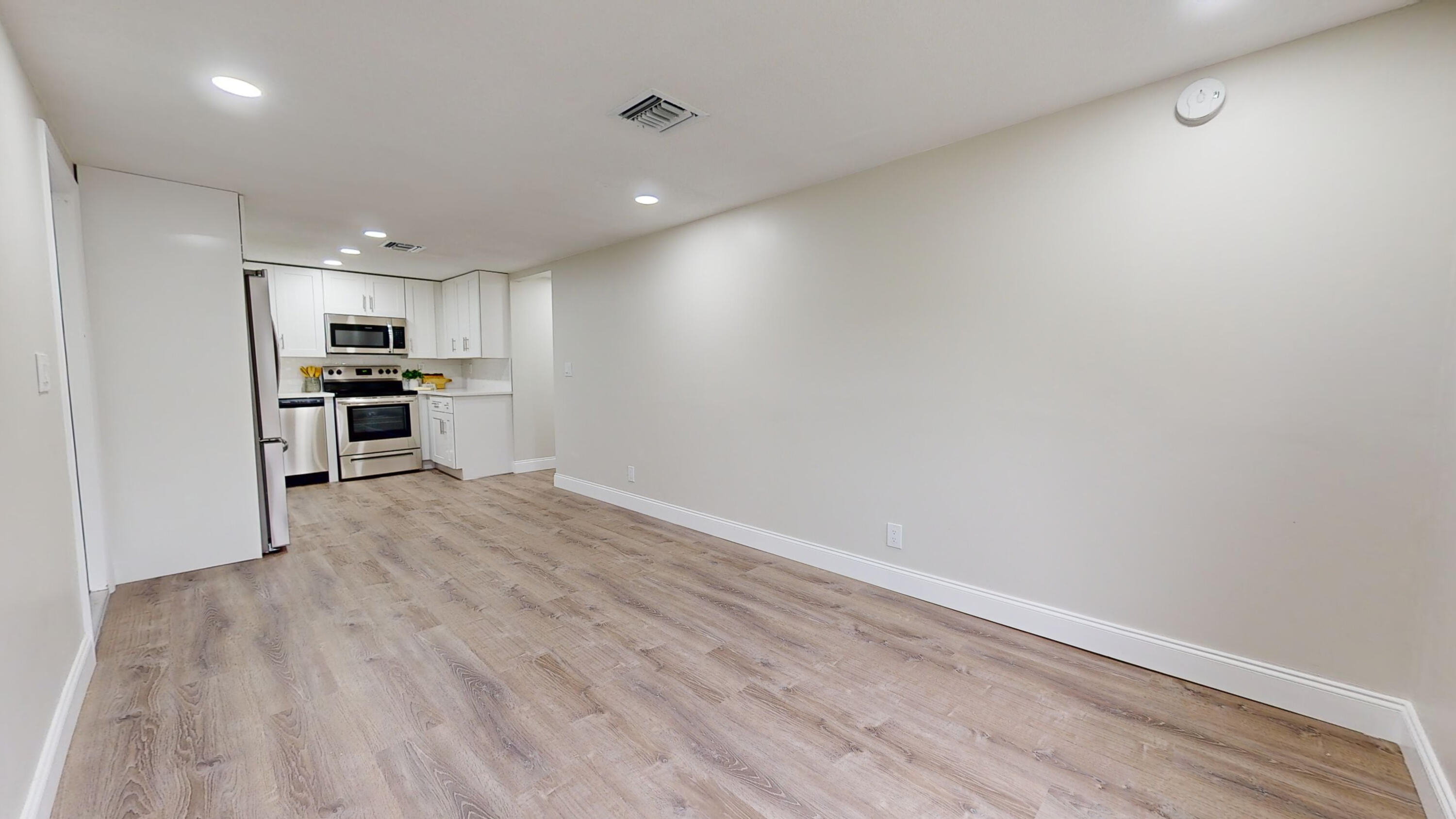 6674 4th Street Jupiter, FL 33458 - Photo 5 of 21 a view of kitchen with sink and wooden floor
