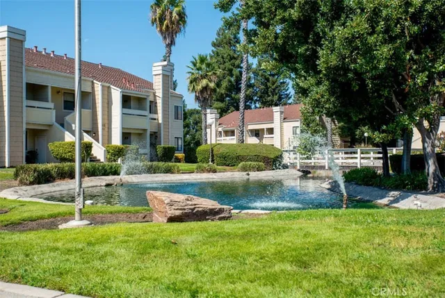 a view of a house with a backyard porch and sitting area