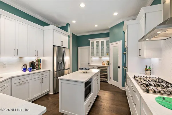 a view of workspace with wooden floor windows
