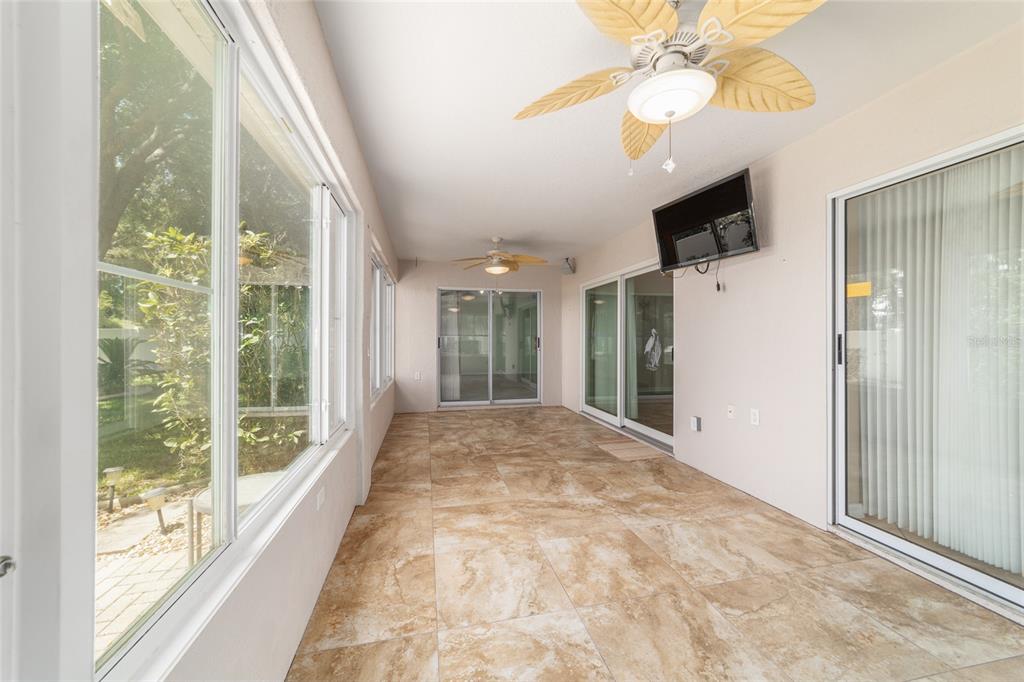 16369 Southwest 14th Avenue Road Ocala, FL 34473 - Photo 24 of 49 a view of hallway with chandelier and glass door