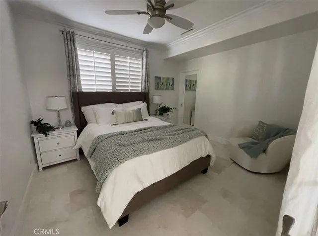 a bedroom with a bed and a couch