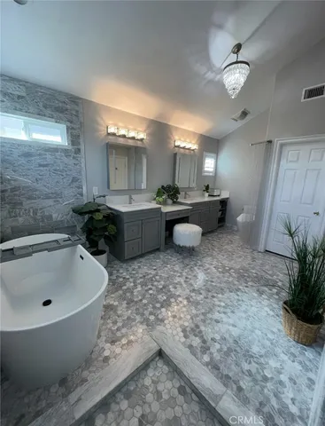 a bathroom with a bathtub and sink